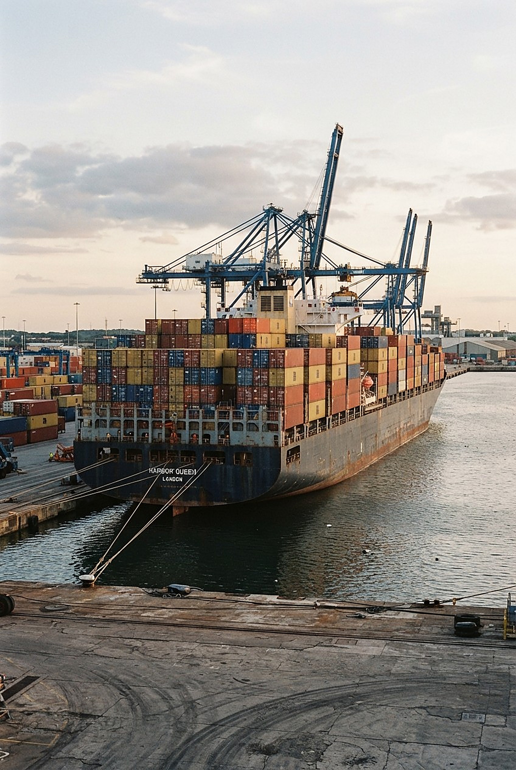 Side view of a container ship docked in port